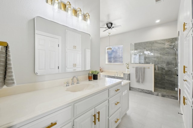 bathroom with vanity, visible vents, a ceiling fan, and a stall shower