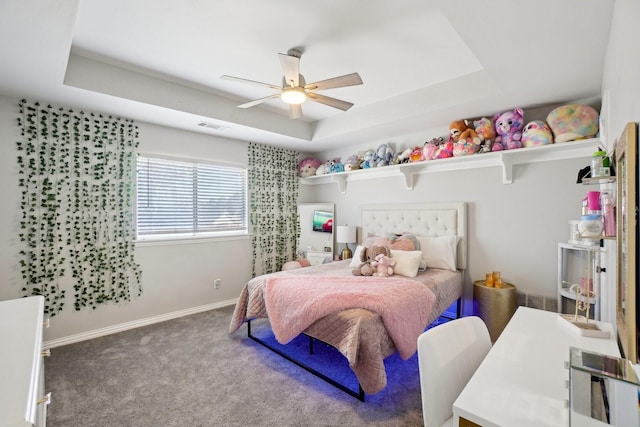 bedroom with visible vents, ceiling fan, baseboards, carpet, and a raised ceiling