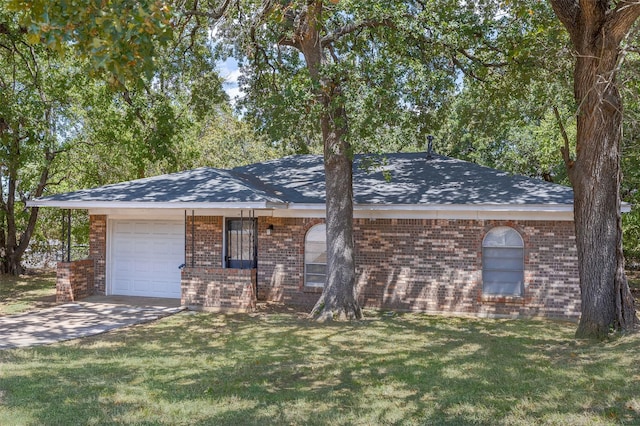 ranch-style home with a garage, driveway, brick siding, and a front yard