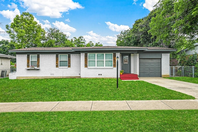 ranch-style home with brick siding, fence, concrete driveway, a front yard, and an attached garage