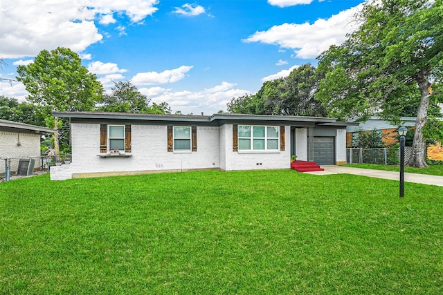 ranch-style house with brick siding, a front lawn, fence, concrete driveway, and an attached garage