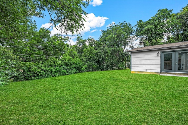 view of yard with french doors