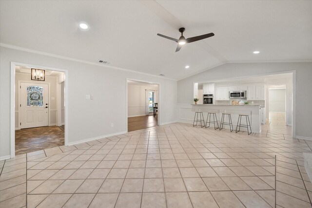 2013 Glenwood Cir, Corsicana, TX 75110 - unfurnished living room featuring crown molding, ceiling fan, french doors, lofted ceiling, and baseboards