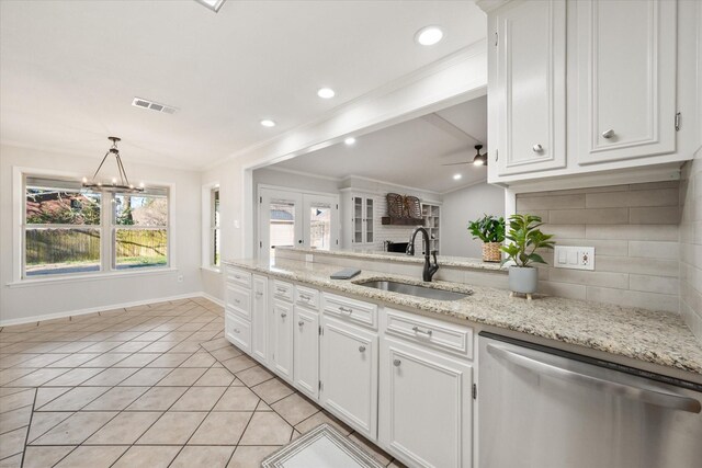 2013 Glenwood Cir, Corsicana, TX 75110 - kitchen featuring appliances with stainless steel finishes, crown molding, white cabinetry, decorative backsplash, and light stone counters