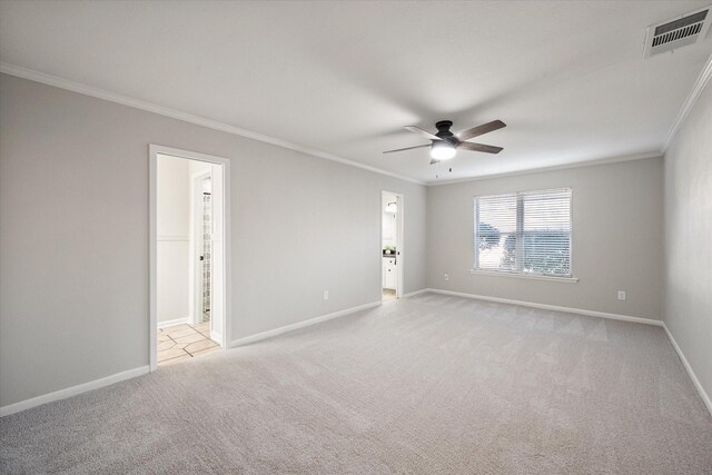 2013 Glenwood Cir, Corsicana, TX 75110 - spare room with a ceiling fan, ornamental molding, baseboards, and light colored carpet