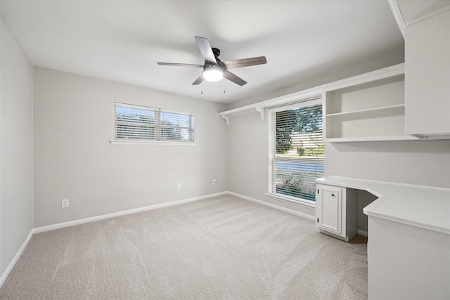 2013 Glenwood Cir, Corsicana, TX 75110 - unfurnished bedroom featuring light colored carpet, baseboards, a ceiling fan, and an office area