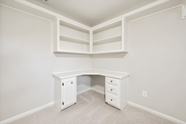 2013 Glenwood Cir, Corsicana, TX 75110 - unfurnished office with light colored carpet, baseboards, and built in desk