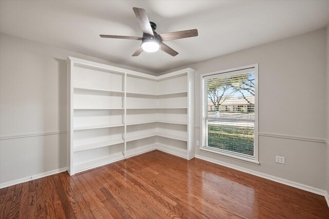 2013 Glenwood Cir, Corsicana, TX 75110 - empty room featuring baseboards, ceiling fan, and wood finished floors