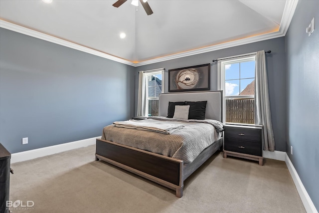 carpeted bedroom with baseboards, crown molding, a ceiling fan, and vaulted ceiling