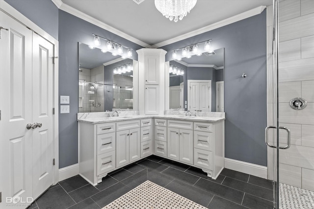 bathroom featuring double vanity, a stall shower, a sink, ornamental molding, and tile patterned floors