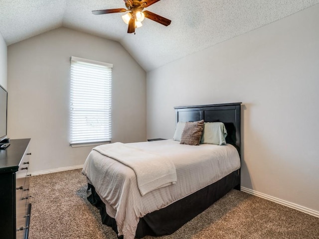 bedroom featuring lofted ceiling, baseboards, carpet floors, and a textured ceiling