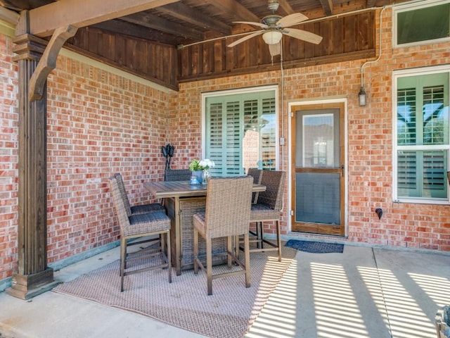 view of patio / terrace with ceiling fan and outdoor dining area