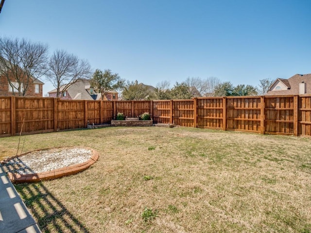 view of yard with a fenced backyard