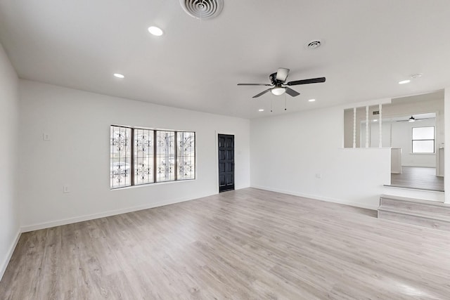 unfurnished living room featuring recessed lighting, visible vents, and light wood finished floors