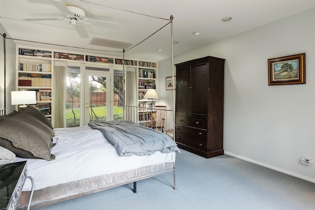 carpeted bedroom with access to exterior and baseboards