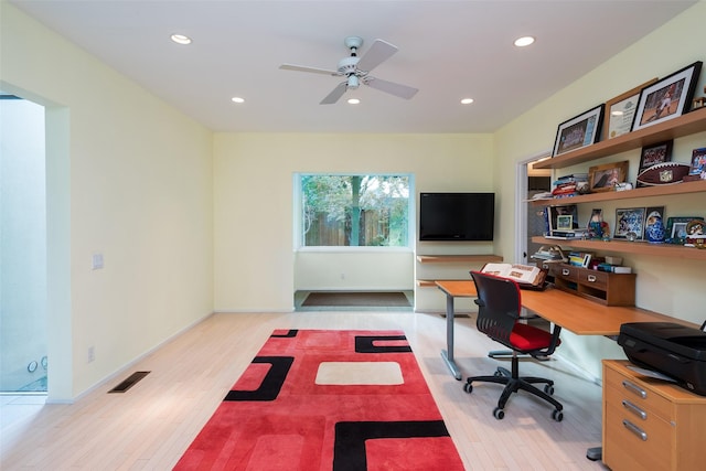 office space with baseboards, light wood finished floors, visible vents, and recessed lighting