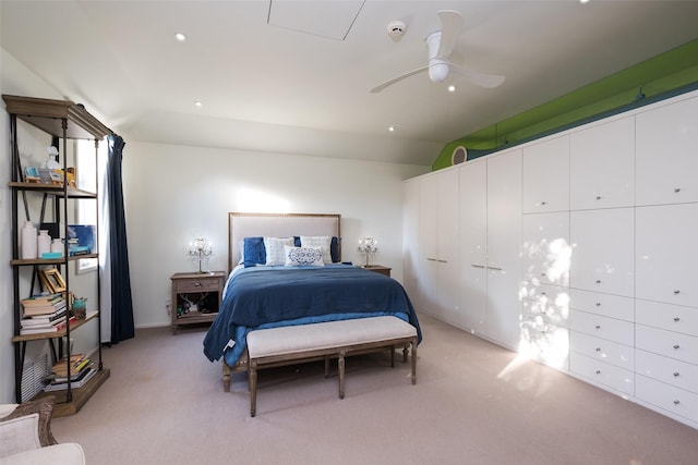 bedroom with lofted ceiling, light carpet, and recessed lighting