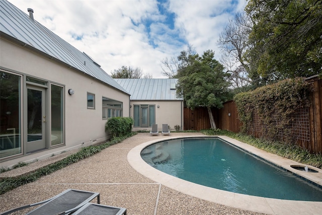 view of pool with a fenced backyard and a fenced in pool