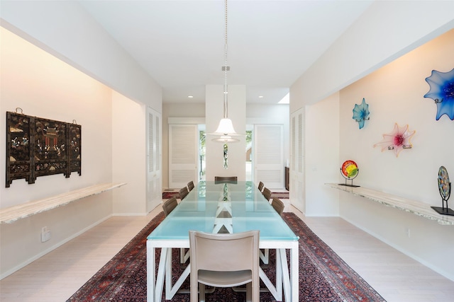 dining room featuring recessed lighting, baseboards, and wood finished floors