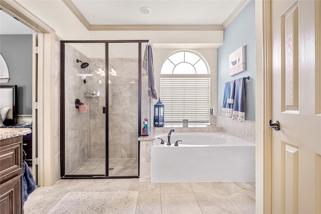 bathroom featuring ornamental molding, a garden tub, and a shower stall