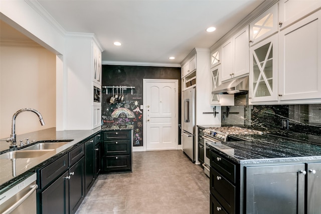 kitchen featuring high end appliances, a sink, white cabinetry, and under cabinet range hood