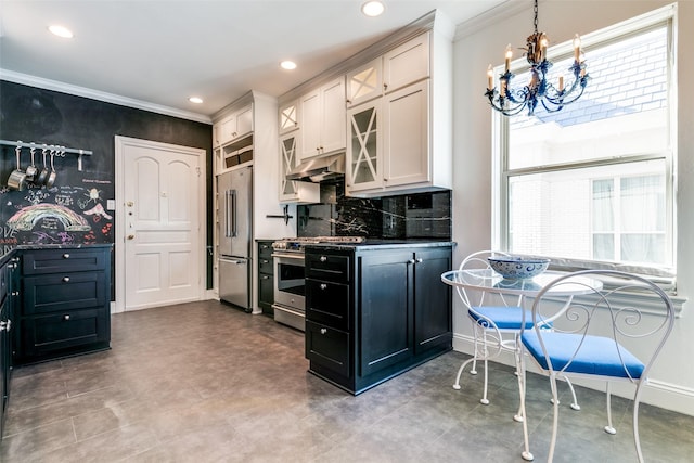 kitchen featuring baseboards, under cabinet range hood, appliances with stainless steel finishes, and crown molding