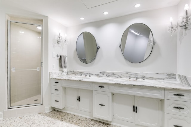 full bath with double vanity, recessed lighting, a sink, and a shower stall