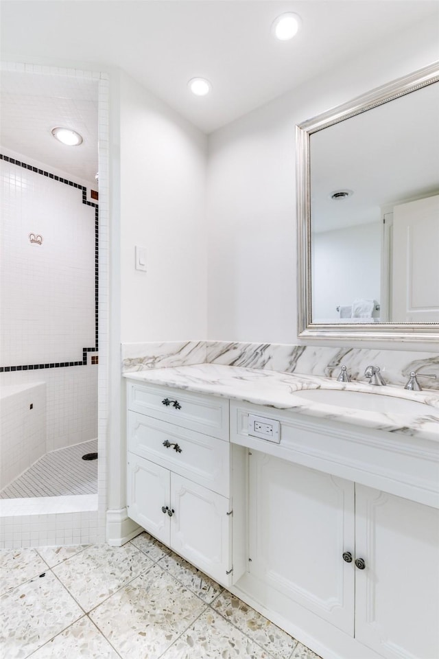 bathroom featuring a stall shower, recessed lighting, vanity, and tile patterned floors