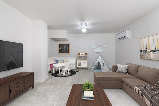 living area with a ceiling fan, a wall mounted air conditioner, light carpet, and baseboards