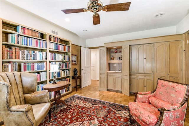 sitting room featuring a ceiling fan, recessed lighting, and visible vents