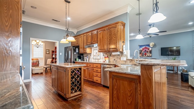 kitchen featuring stainless steel appliances, crown molding, under cabinet range hood, and dark wood-style floors