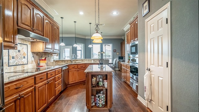 kitchen featuring under cabinet range hood, stainless steel appliances, a peninsula, decorative backsplash, and crown molding