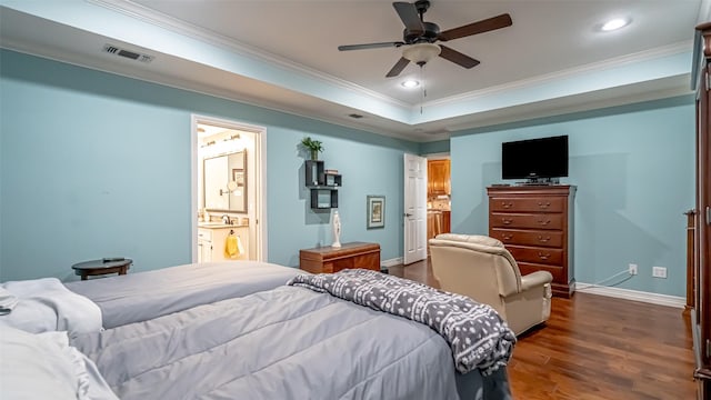 bedroom featuring recessed lighting, visible vents, ornamental molding, dark wood-style floors, and a raised ceiling