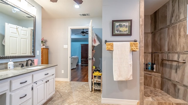 full bath with a ceiling fan, visible vents, vanity, and baseboards