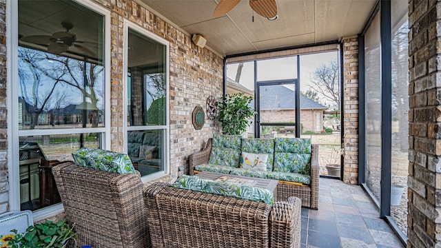 sunroom with wooden ceiling, ceiling fan, and a wealth of natural light