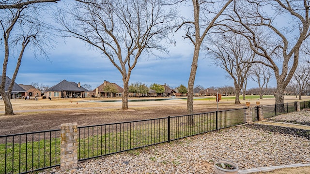 view of yard with a residential view and fence