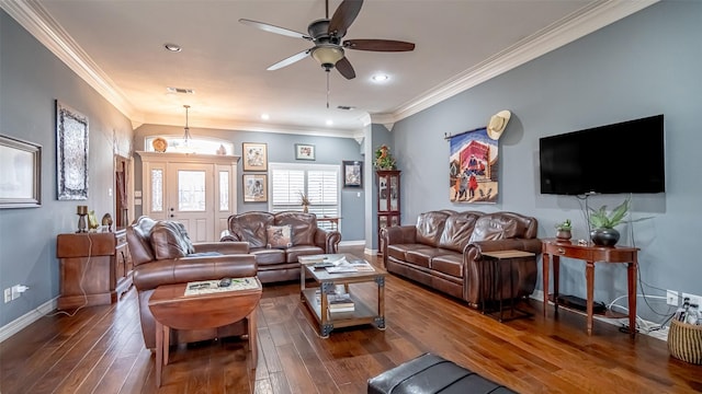 living area featuring dark wood-style flooring, visible vents, crown molding, and baseboards