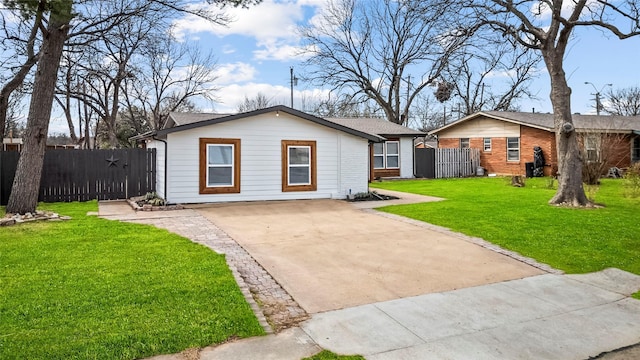 single story home featuring brick siding, fence, driveway, and a front lawn