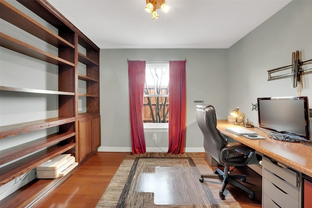 office with baseboards and wood finished floors