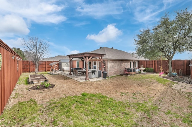 back of house with brick siding, an outdoor structure, a vegetable garden, a pergola, and a patio area