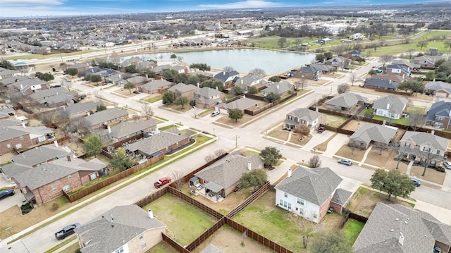 birds eye view of property with a residential view and a water view