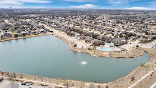 birds eye view of property featuring a water view and a residential view