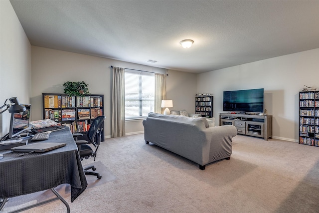 living area with light carpet, visible vents, baseboards, and a textured ceiling