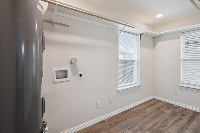 washroom with washer hookup, dark wood-type flooring, electric dryer hookup, laundry area, and baseboards