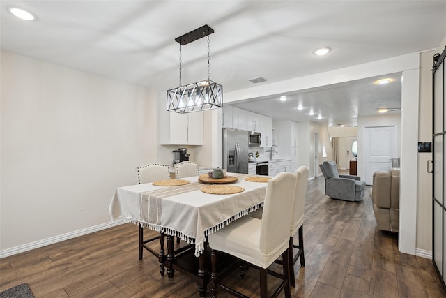 dining area with visible vents, baseboards, dark wood-type flooring, and recessed lighting