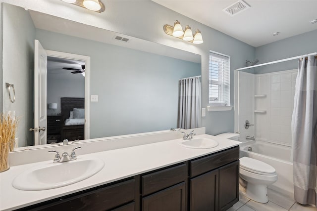 bathroom with double vanity, visible vents, and a sink