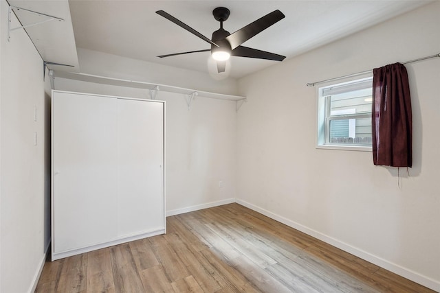 interior space featuring wood finished floors and baseboards