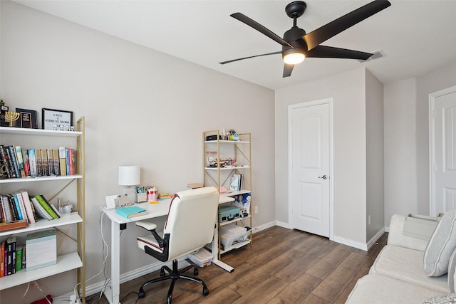 office featuring ceiling fan, wood finished floors, and baseboards