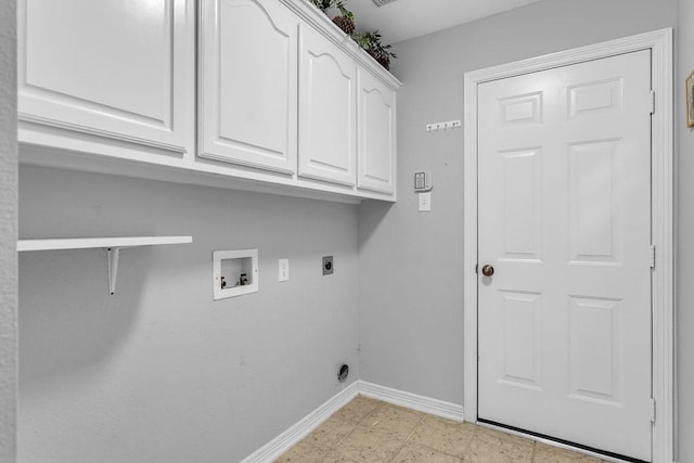 laundry room with cabinet space, hookup for a washing machine, baseboards, and electric dryer hookup