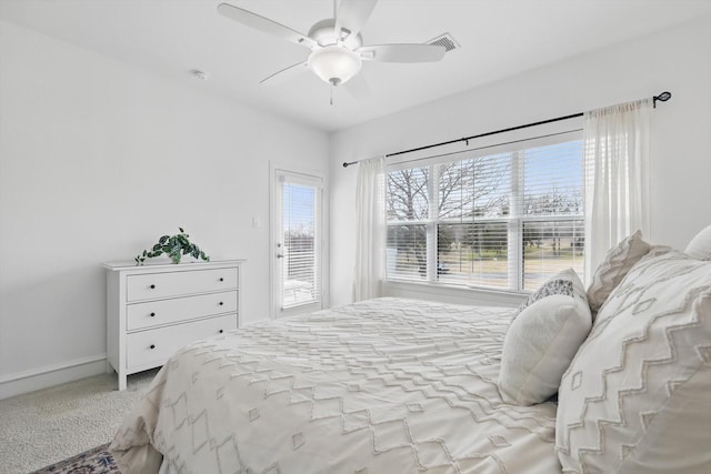 bedroom featuring carpet, visible vents, ceiling fan, access to outside, and baseboards